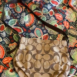 A tan and brown coach purse